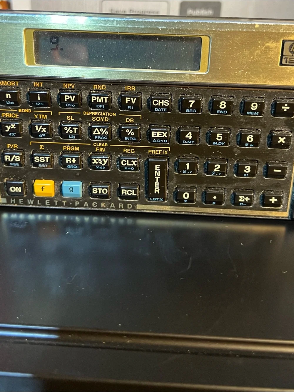 HP Black Financial Calculator with Gold Trim and Colored Function Keys